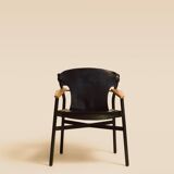 Maërl armchair, Galathée model, black leather, solid wood armrests of your choice