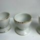 Trio of white shells bordered gold 50s