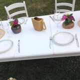 White farmhouse table set and four chairs
