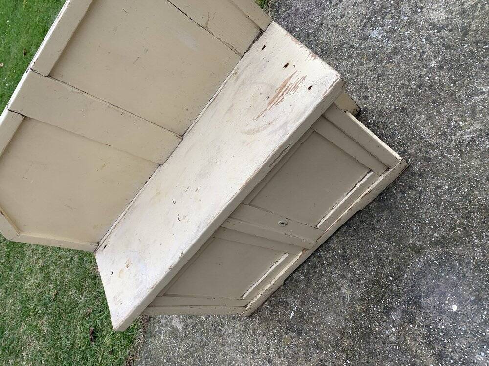 Small vintage yellow bench made of hand-painted wood, low storage from the 1920s.