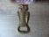 Owl-shaped bottle opener in handmade brass from India.
