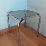 Square coffee table in chromed metal and smoked glass