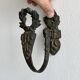 Antique black patinated metal coat hook.