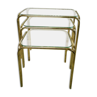 Trio of nesting tables in gold metal