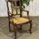 20th-century armchair in beech with a straw seat in Louis XV style.