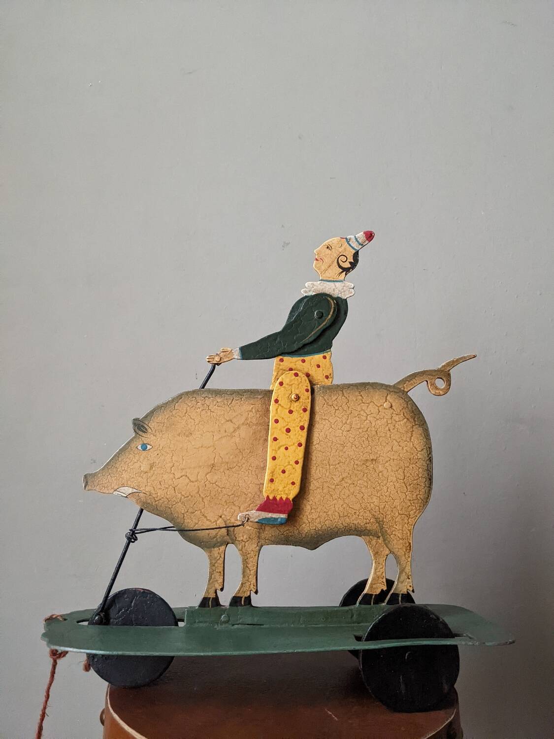 Antique pull toy, metal, hand-painted decoration, clown circus