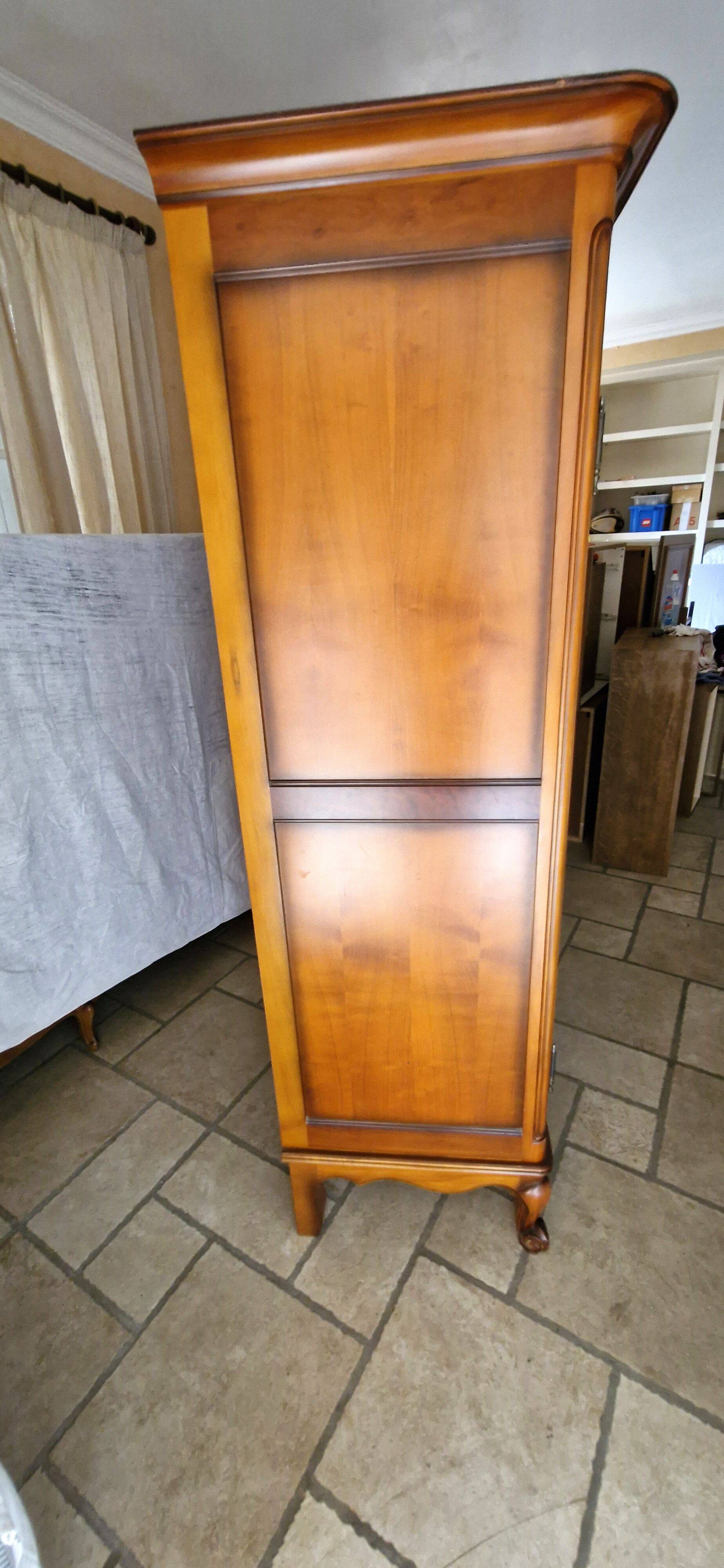 Wooden style wardrobe, 3 doors and 9 internal shelves.