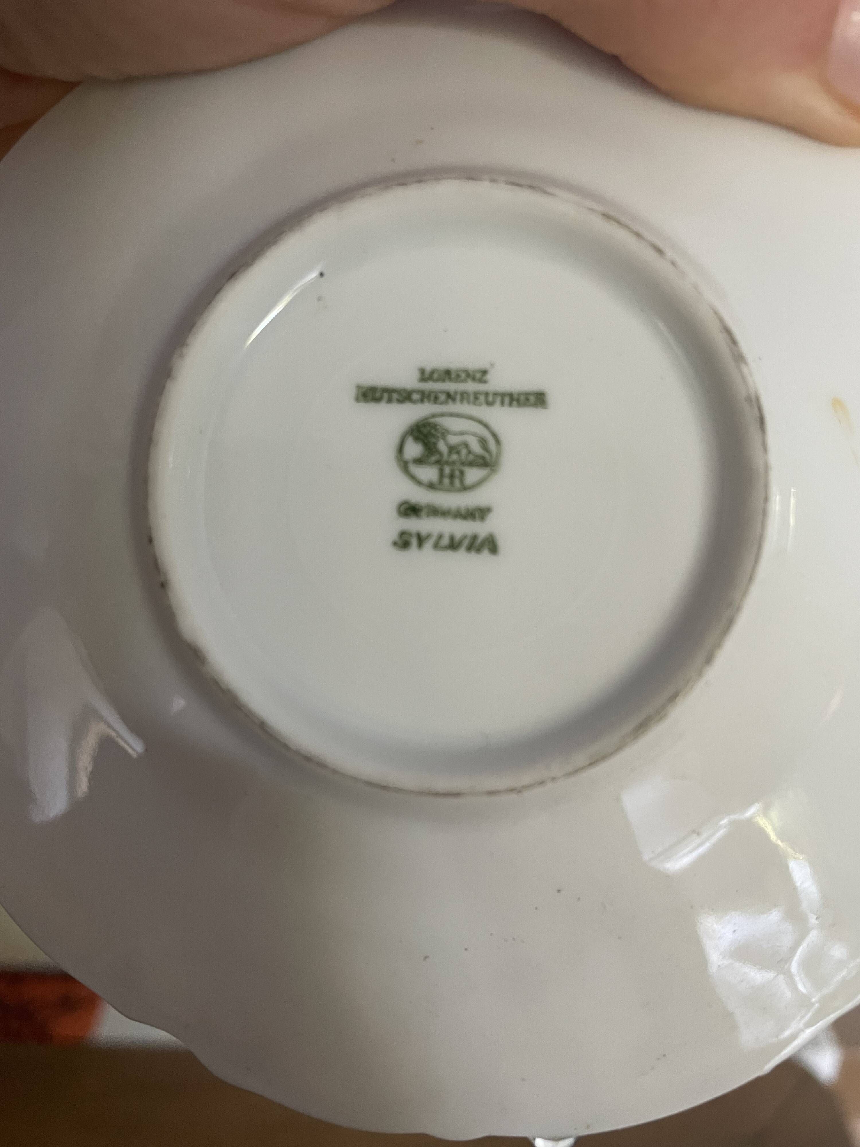 Set of 4 Hutschenreuther fine porcelain cups and saucers.