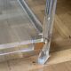 2 side tables in plexiglass, glass, and brass.