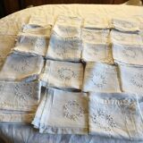 Table service with white handmade embroidery on linen canvas