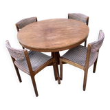 Extendable round dining table and 4 Baumann chairs.