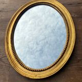 Antique gilded oval mirror