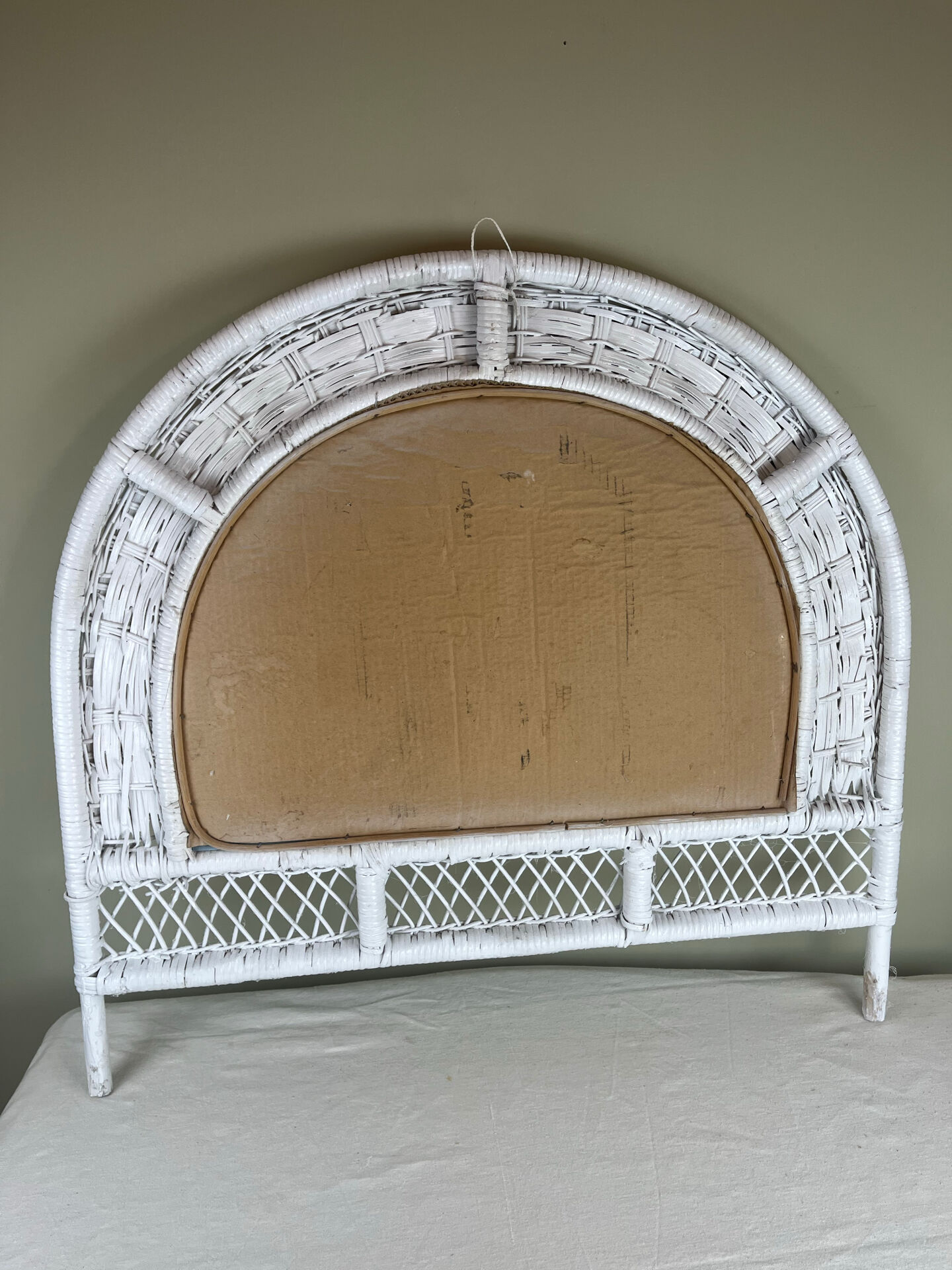 Half-moon wicker mirror