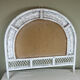 Half-moon wicker mirror