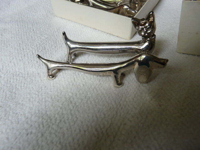 12 silver metal knife holders 6 dogs and 6 cats
