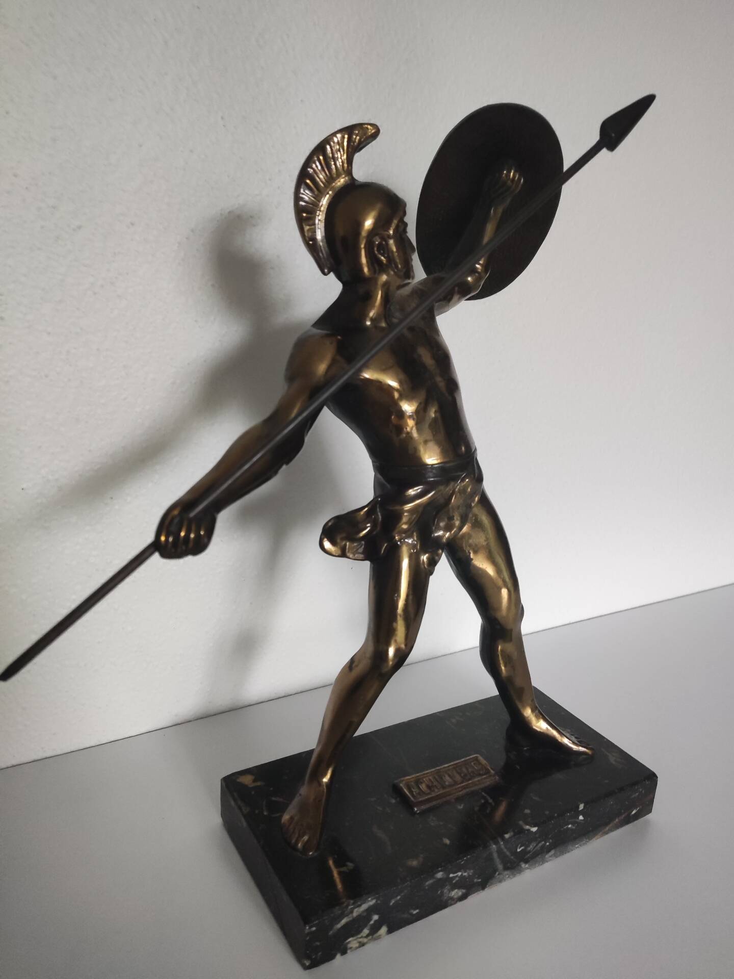 Large statue of Achilles, Greek warrior, marble base, ancient mythology.