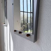 Pair of "Memphis" mirrors from the 80s in chrome and wood.
