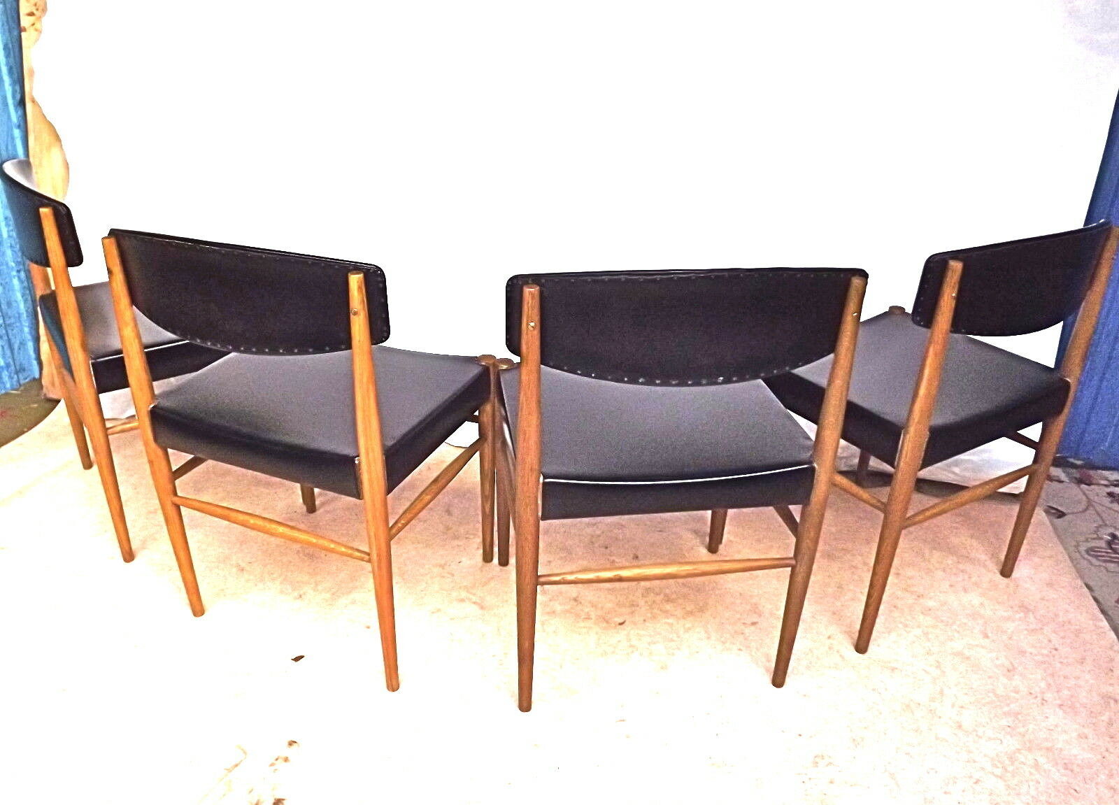 Four Scandinavian-style chairs