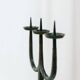 Black hand-forged iron candleholder statue with mid-century, 70s Brutalist tripod design
