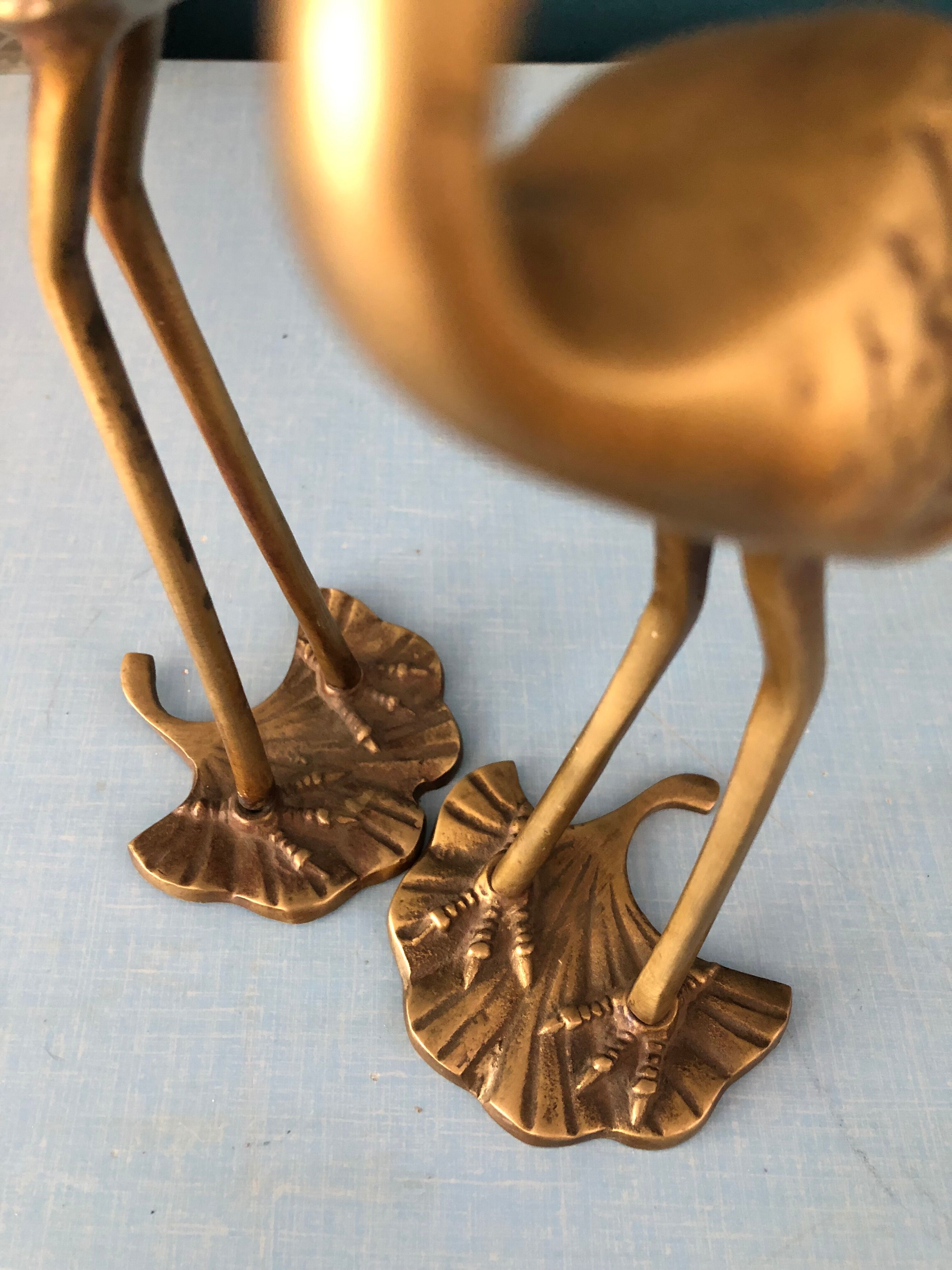 Couple of brass herons