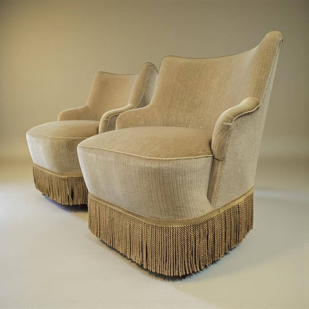 Set of 2 vintage 'gold' armchairs with fringes.