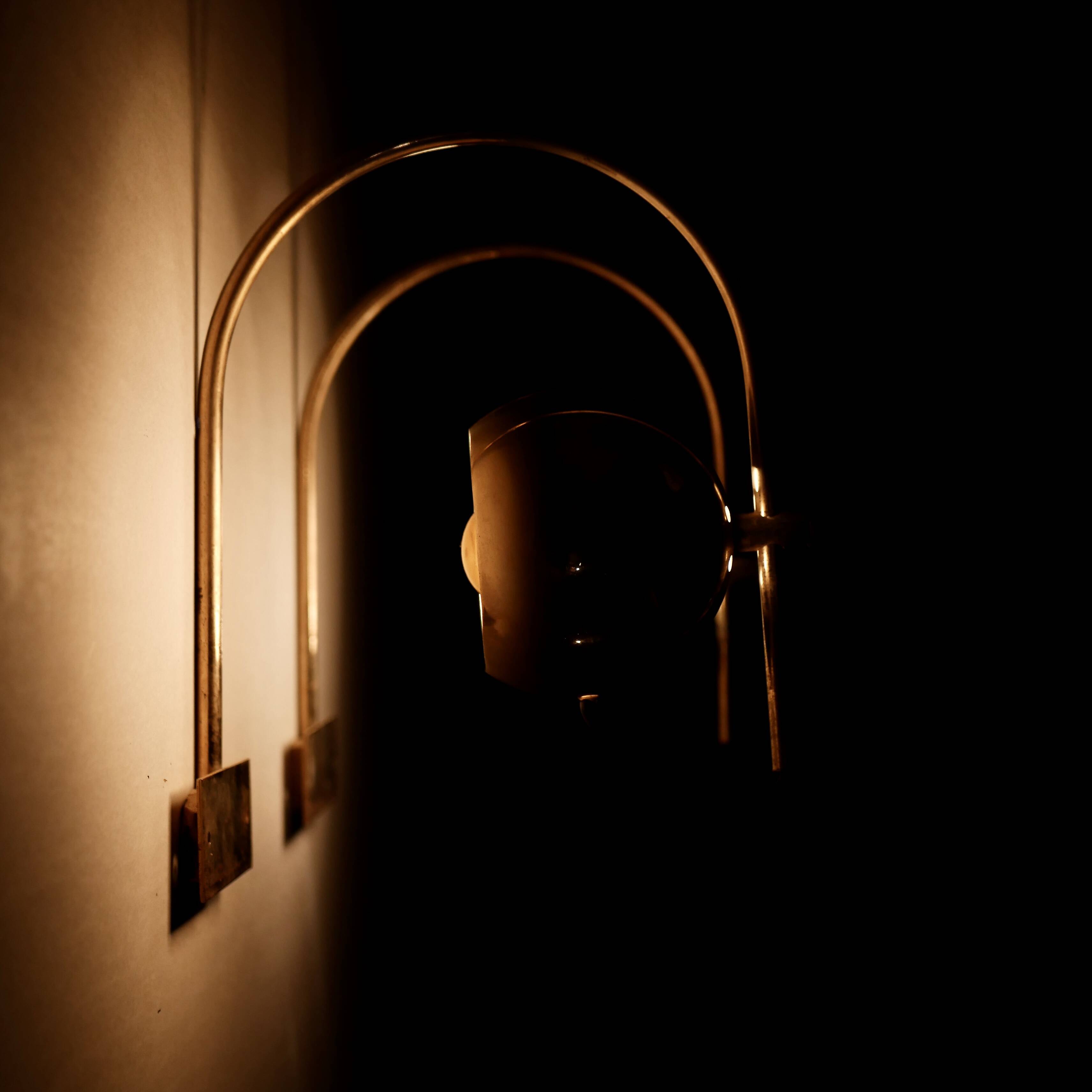 Pair of brass eyeball wall lights