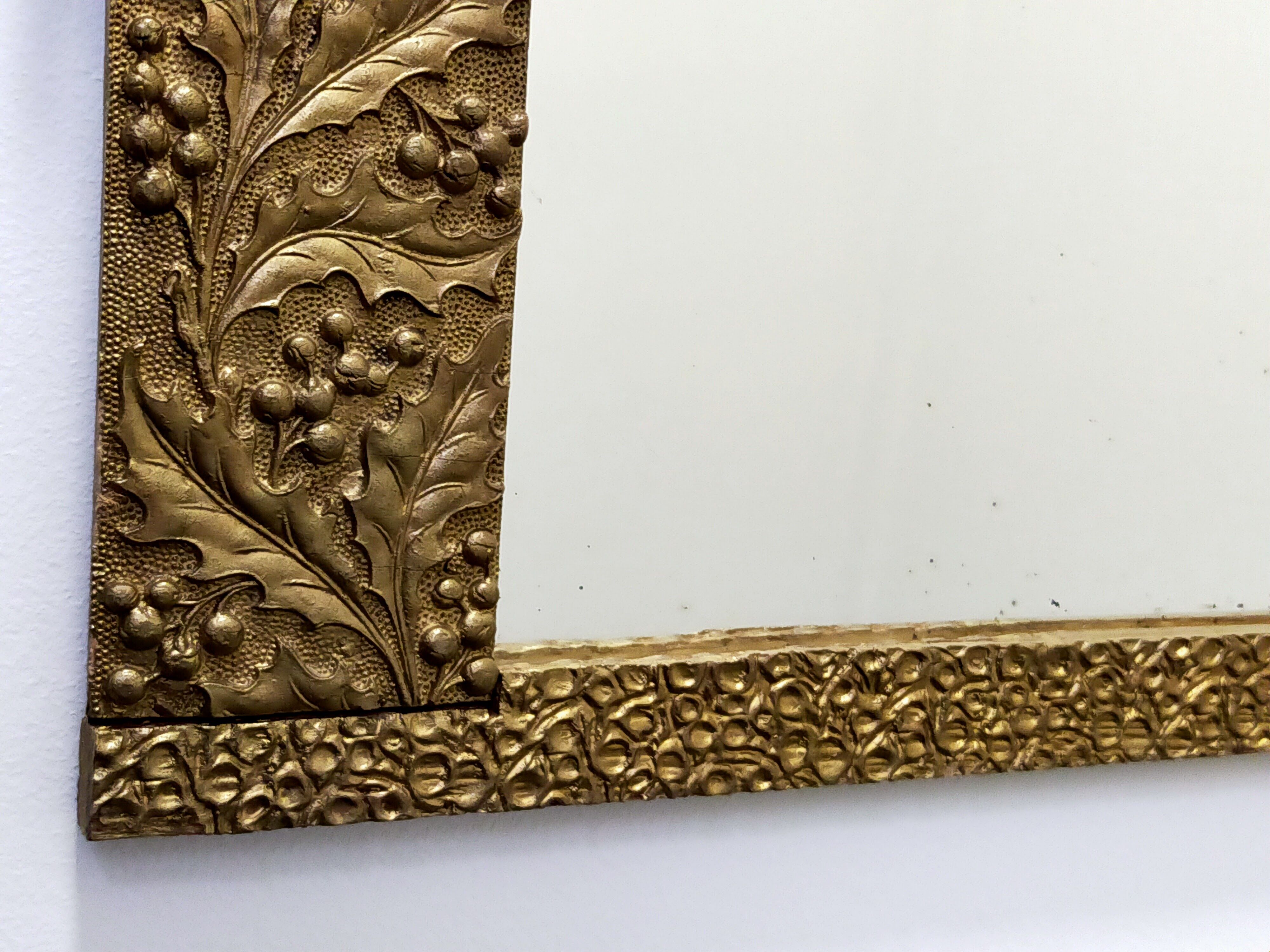 Art-deco gold mirror with vegetal décor  52x31cm