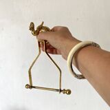 Swan toilet paper dispenser in brass