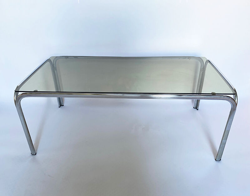 Metal table and smoked glass