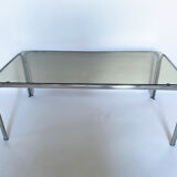 Metal table and smoked glass