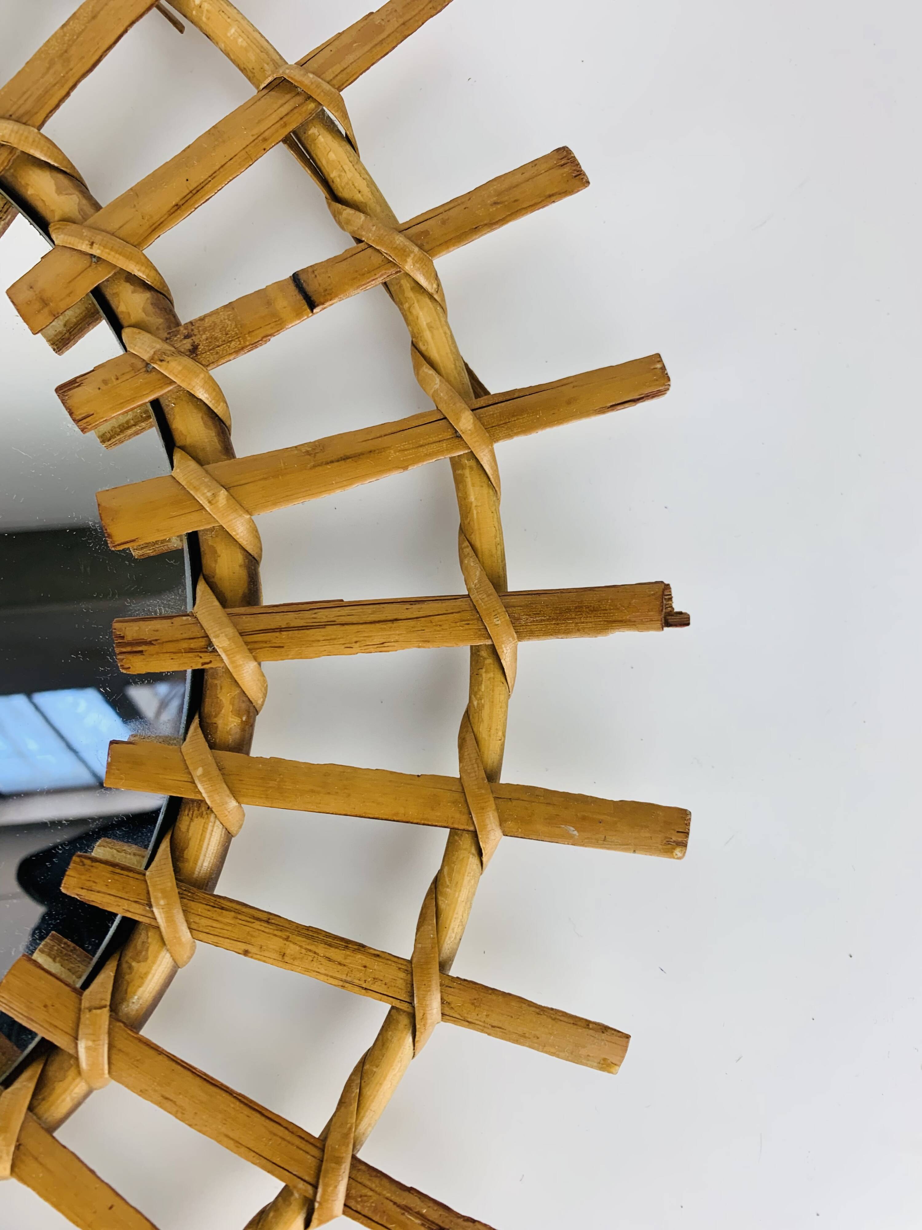 Vintage rattan sunburst mirror from the 1960s