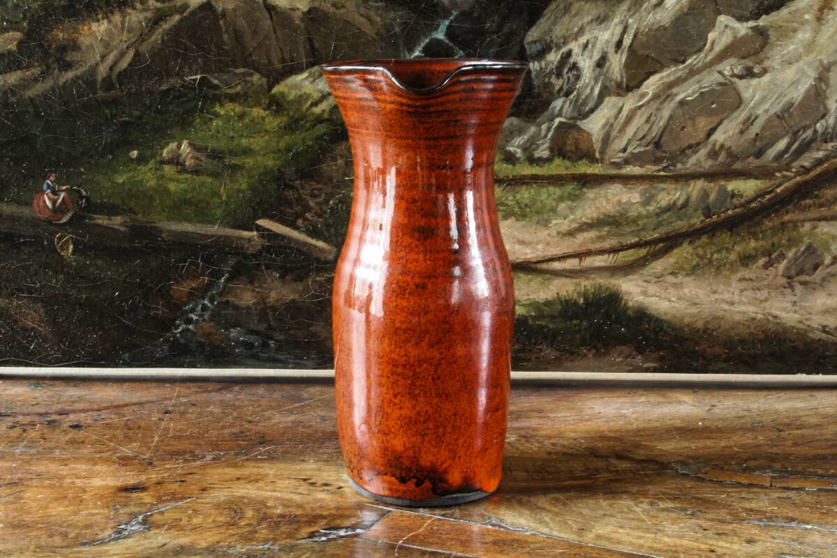 Signed orange ceramic candle holder and jug