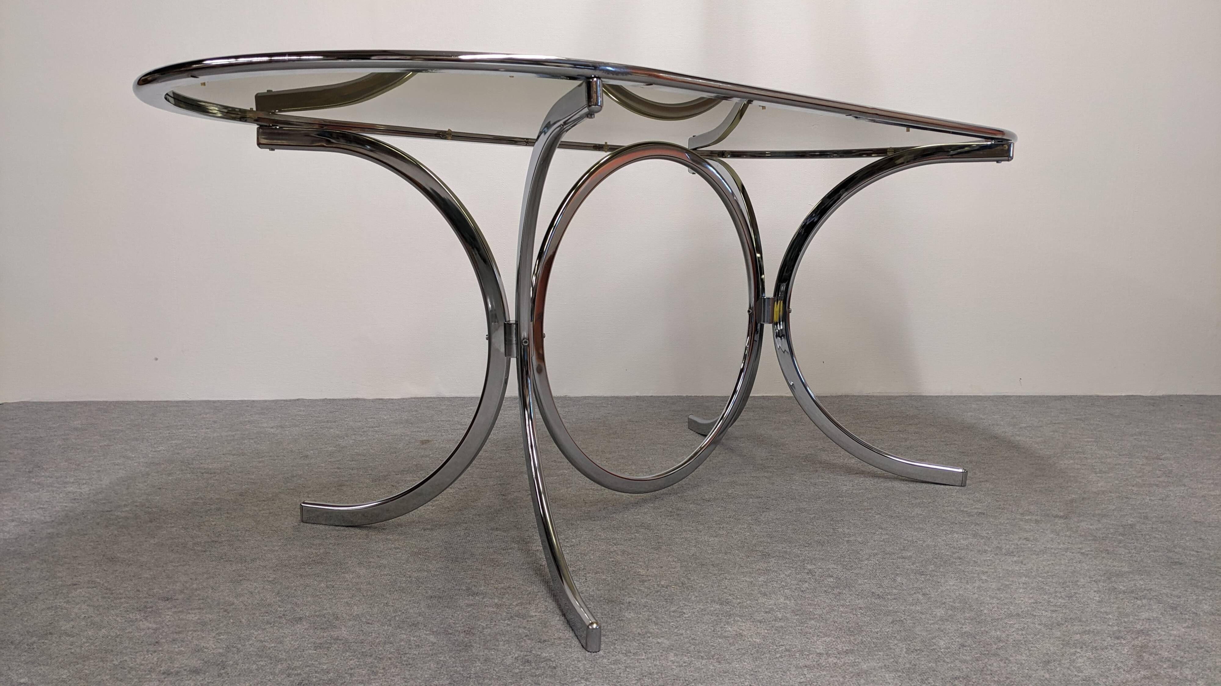 Chrome metal and smoked glass dining table, Italy circa 1970.
