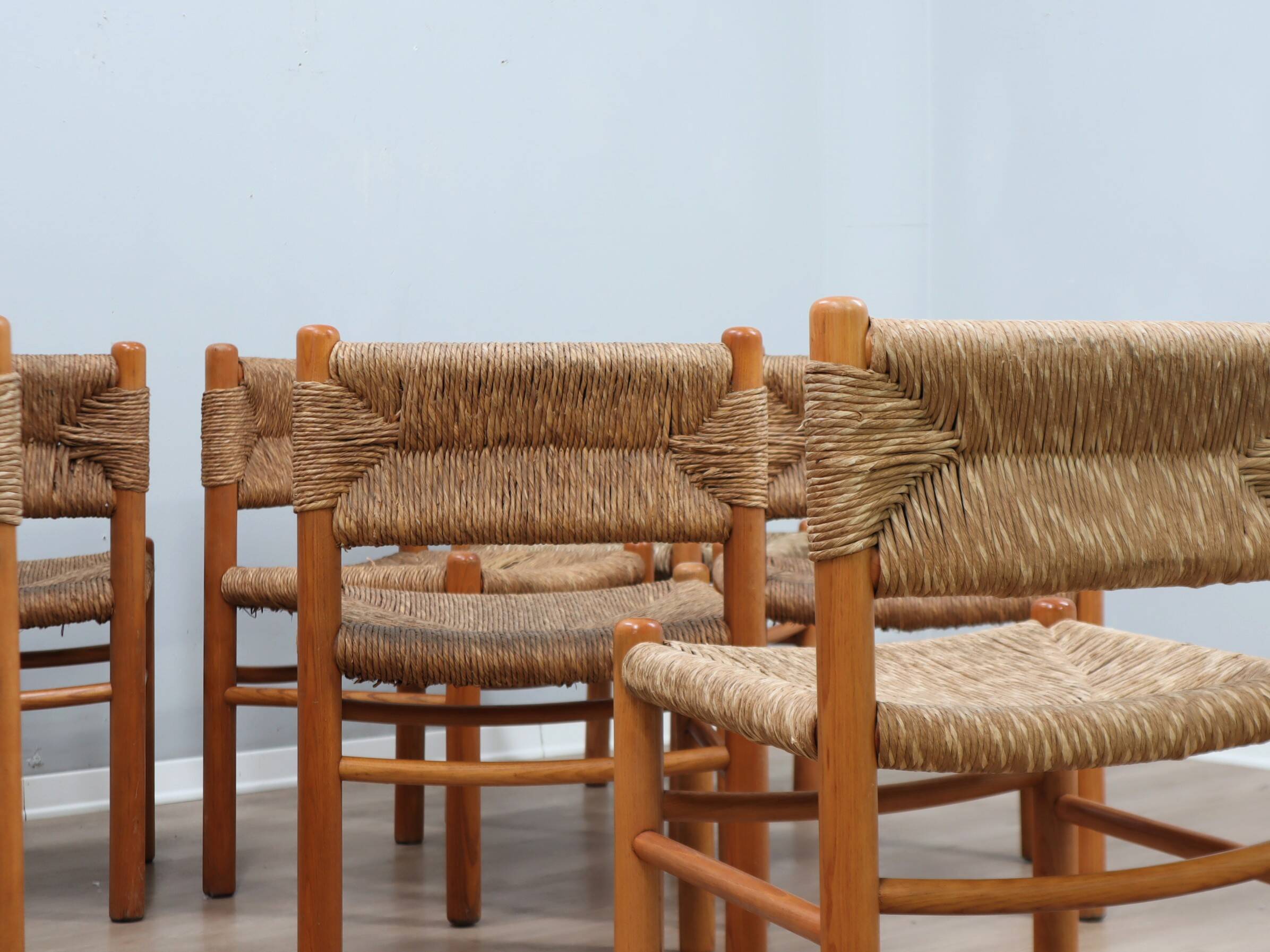 Set of 8 chairs 1960s Charlotte Perriand Style woven straw & wood