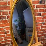 Oval mirror in a frame