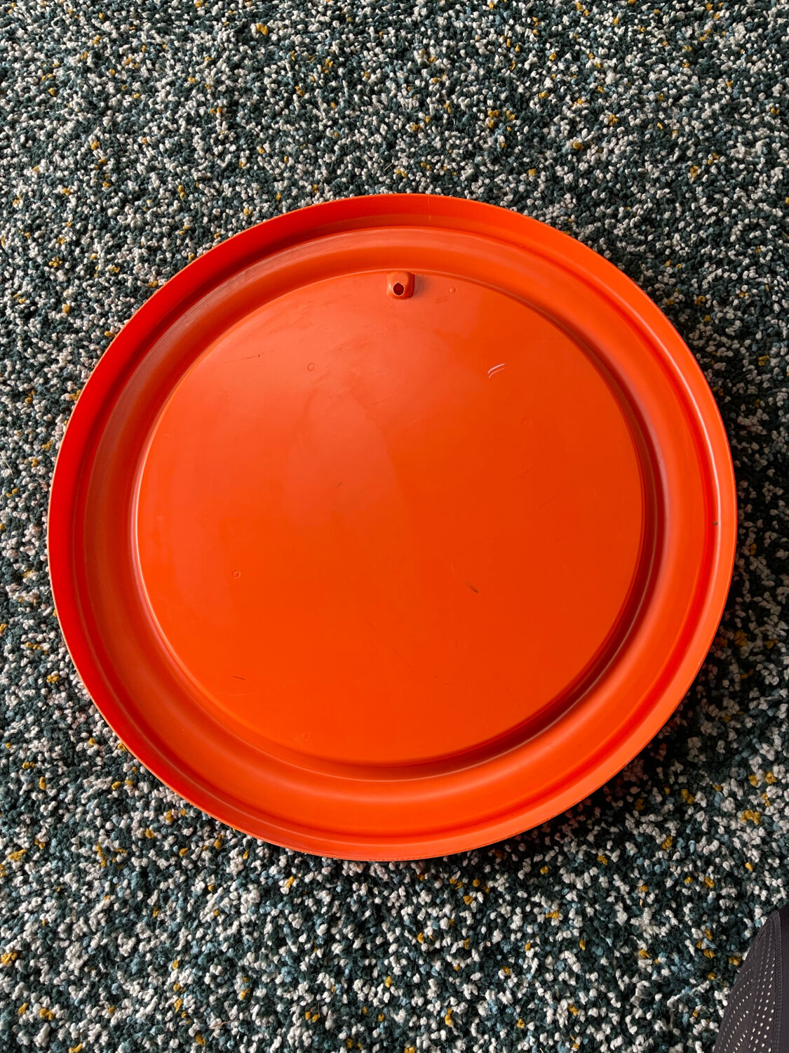 Mirror with round frame in orange molded plastic by carrara & matta, 1974