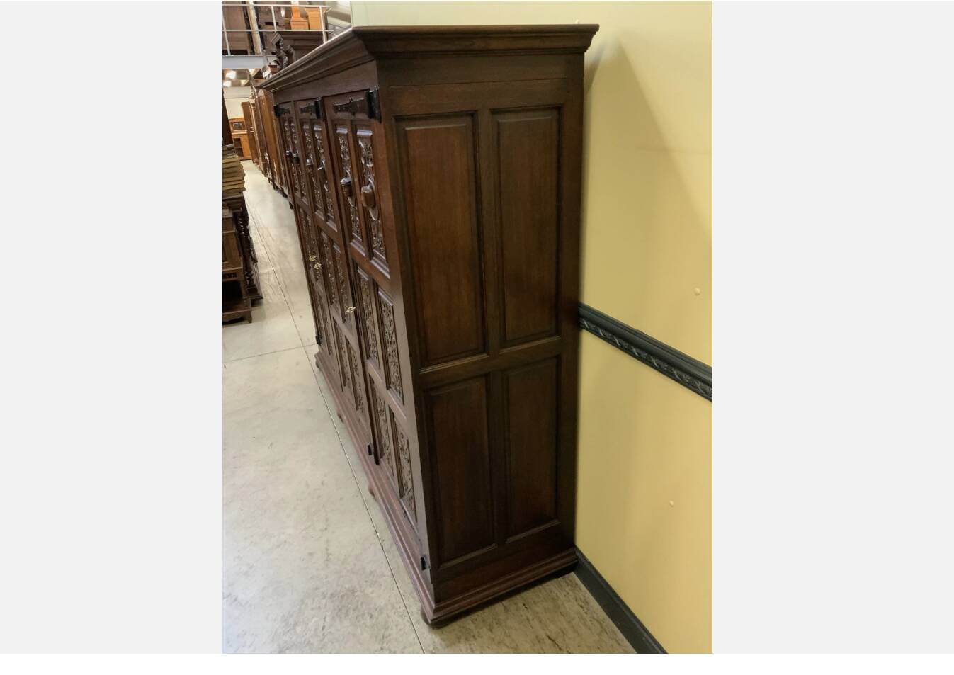 Antique neo-Gothic wardrobe with linen drawers.