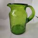Bubble glass pitcher in the style of Biot or Empoli.