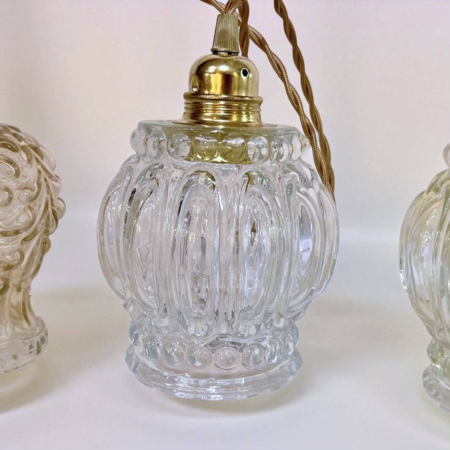 Cascade pendant light with 3 molded glass globes in vintage arabesque amber glass