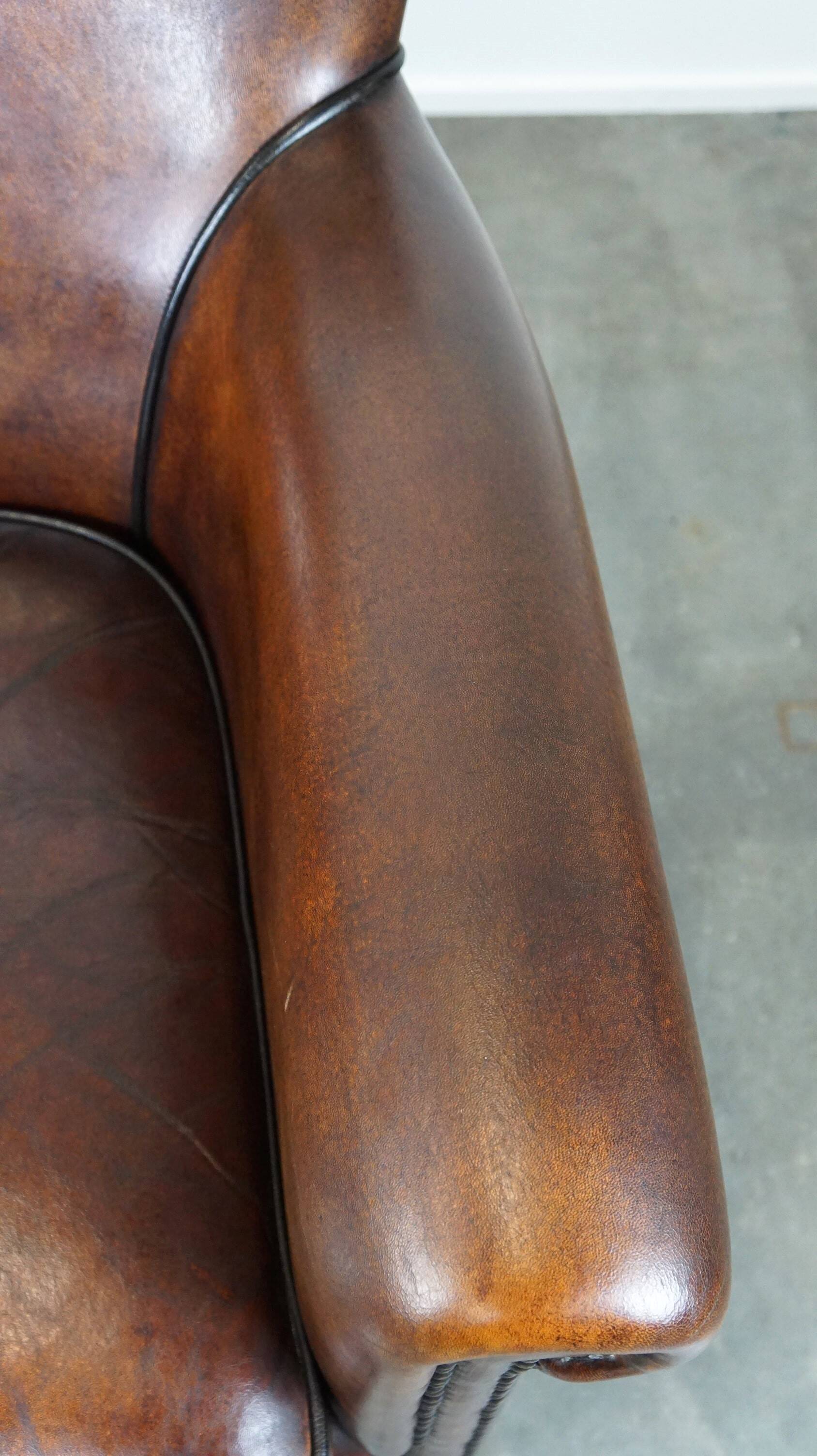 Stylish sheepskin leather armchair with a refined appearance