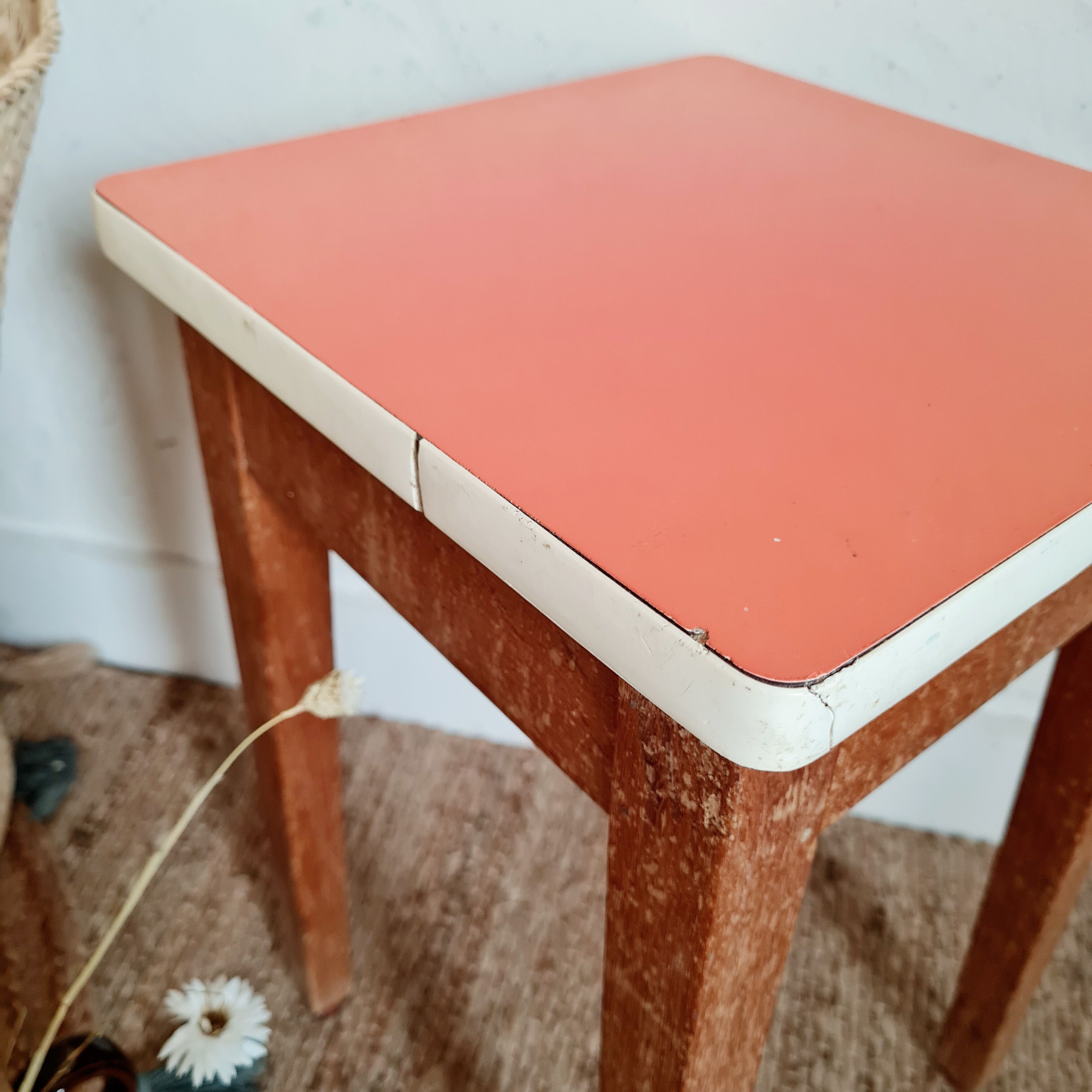 Wooden wax stool and orange formica