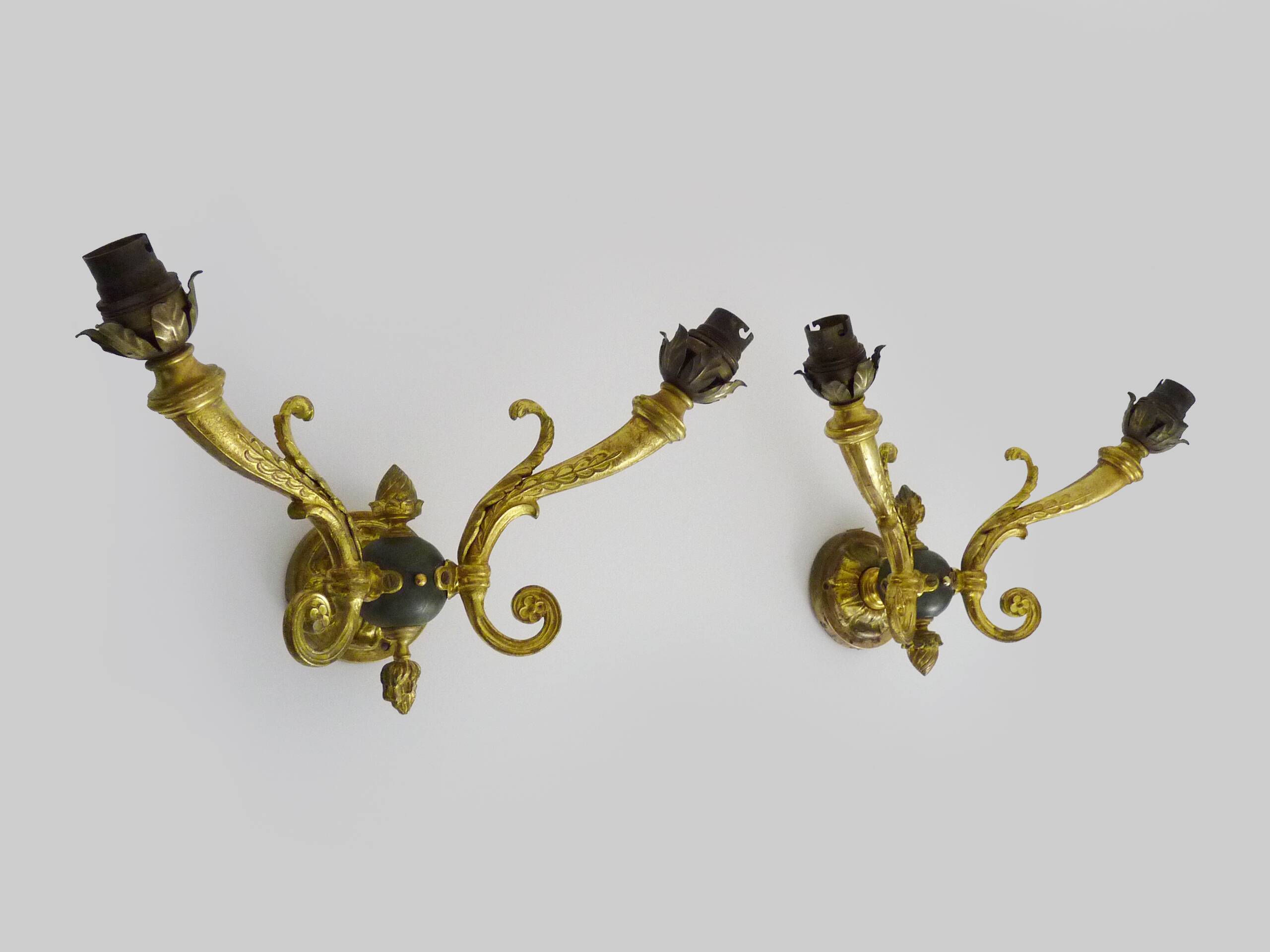 Pair of double-light Empire style wall lights in bronze