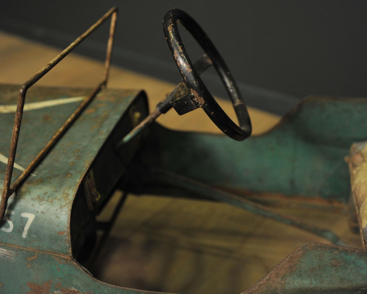 Green metal pedal car