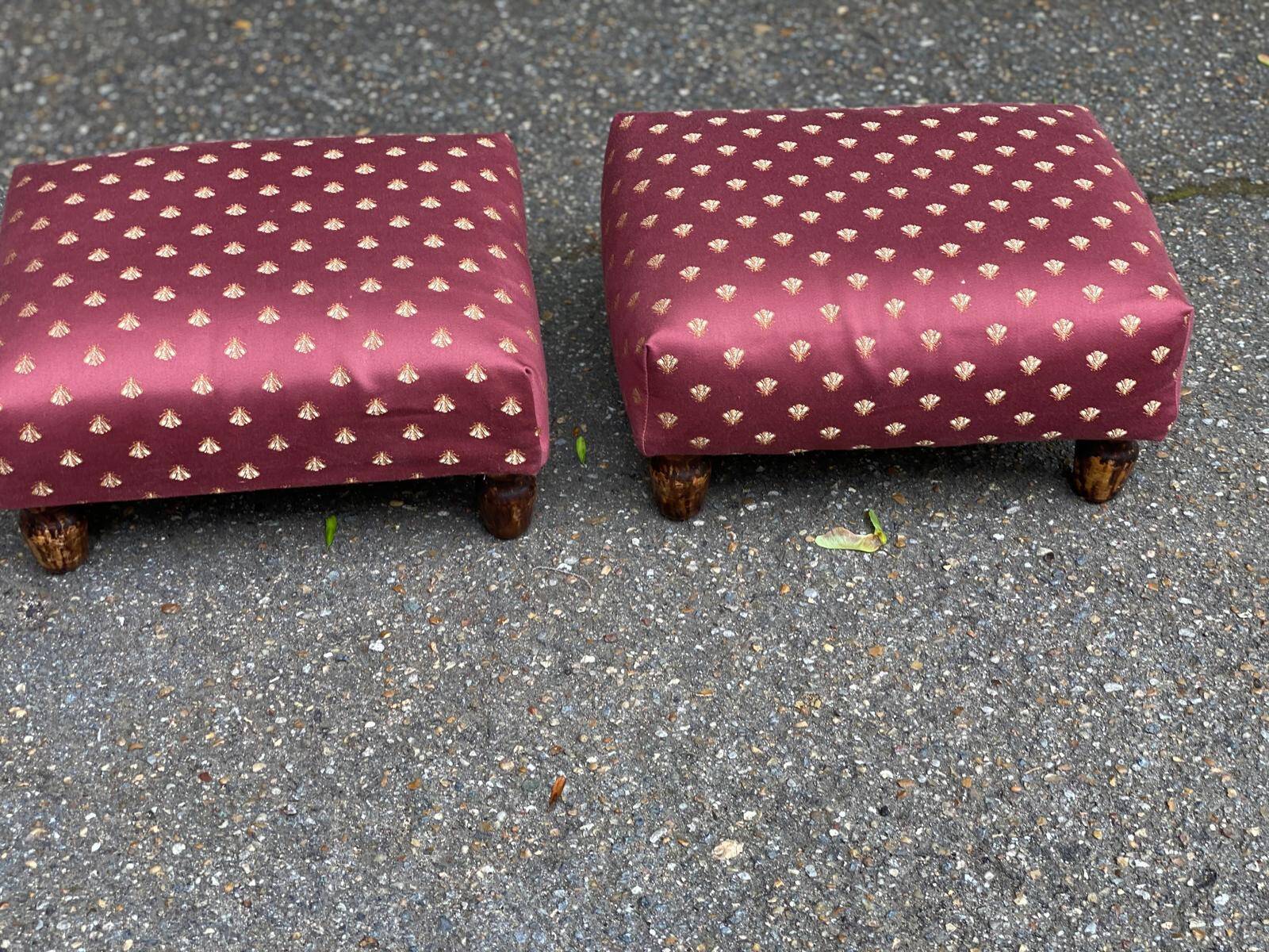 2 low footstools in burgundy fabric and solid wood