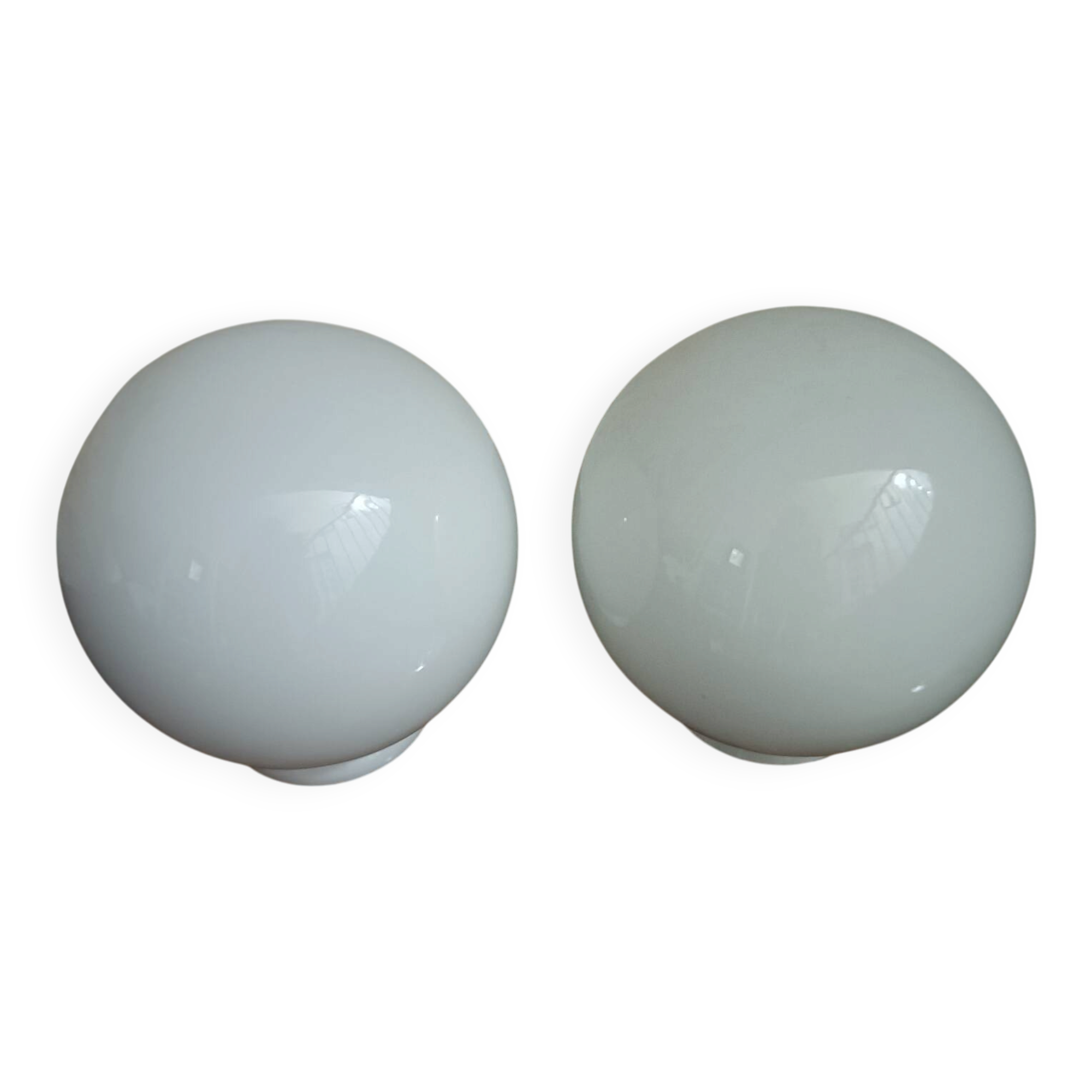 Pair of spherical lampshades in opaline.