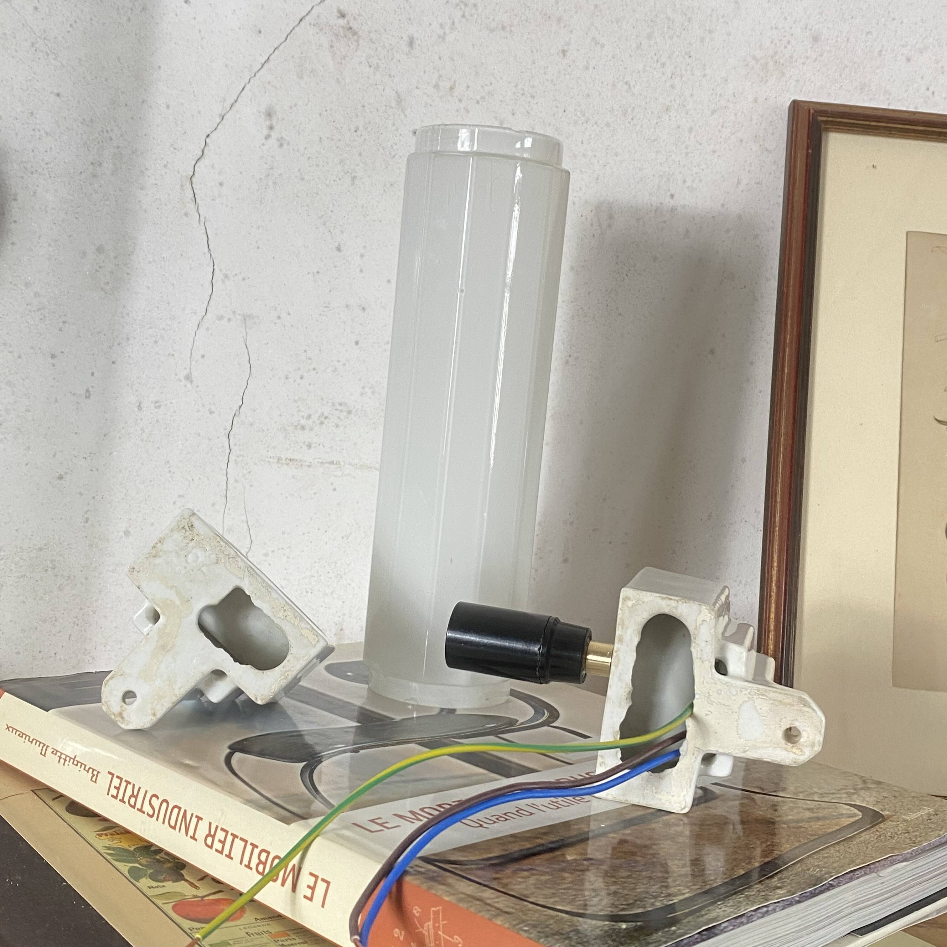Art Deco tubular wall light in ceramic and white opaline glass tube.