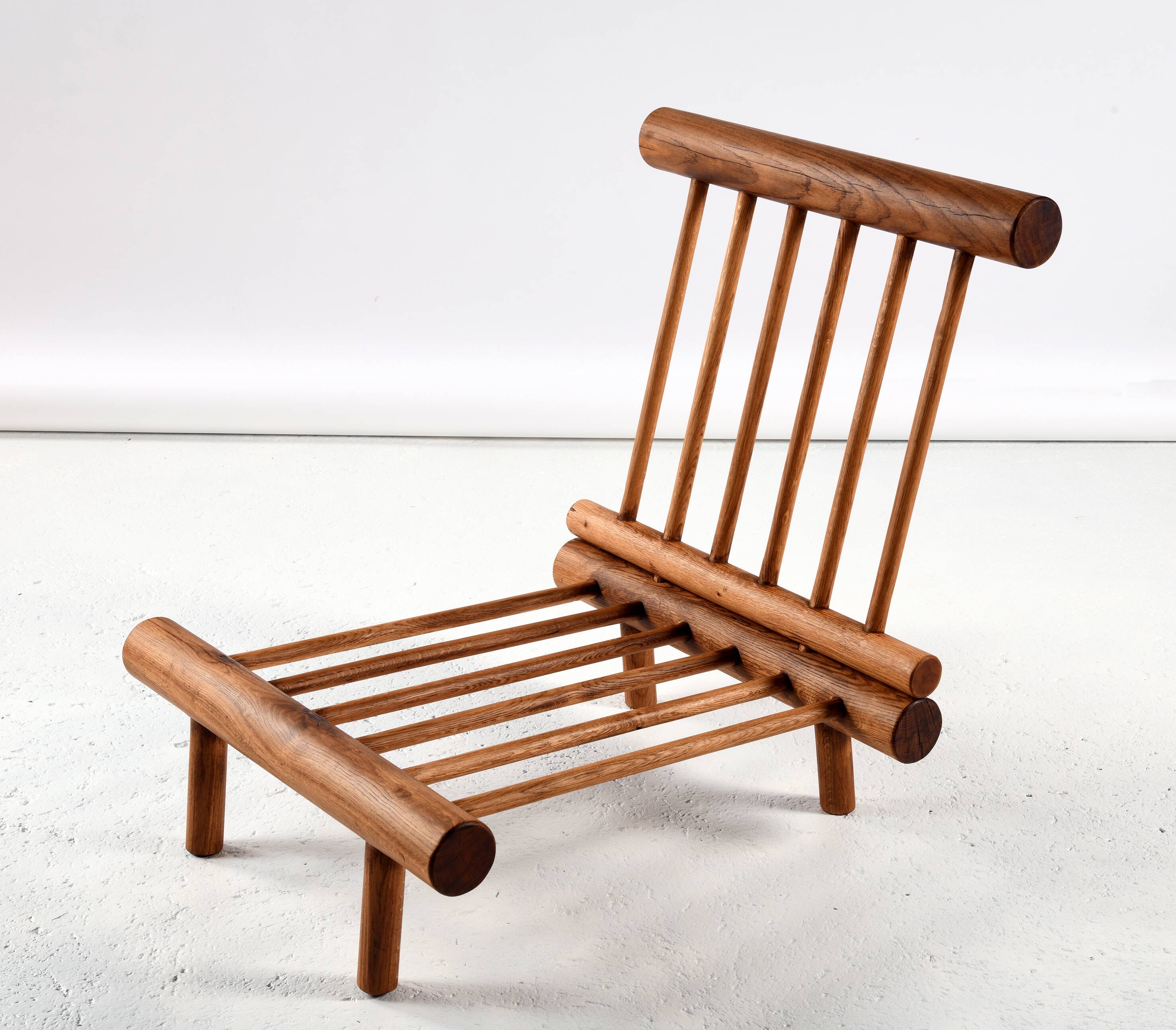 Pair of low chairs called La cachette selected by Charlotte Perriand