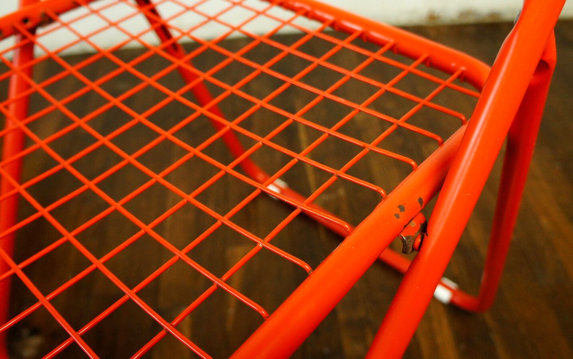 Red "grid" metal folding chair 1980