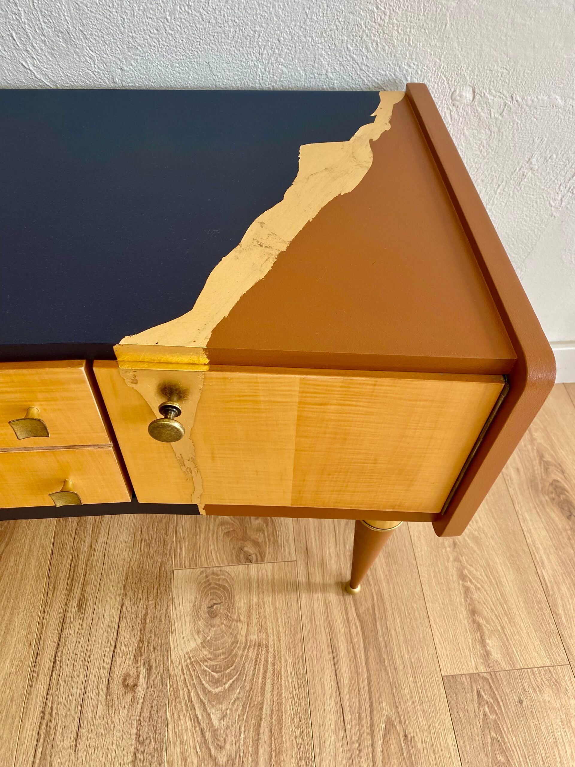 Vintage furniture revamped in navy blue, terracotta, and gold leaf – Reimagined mid-century style.