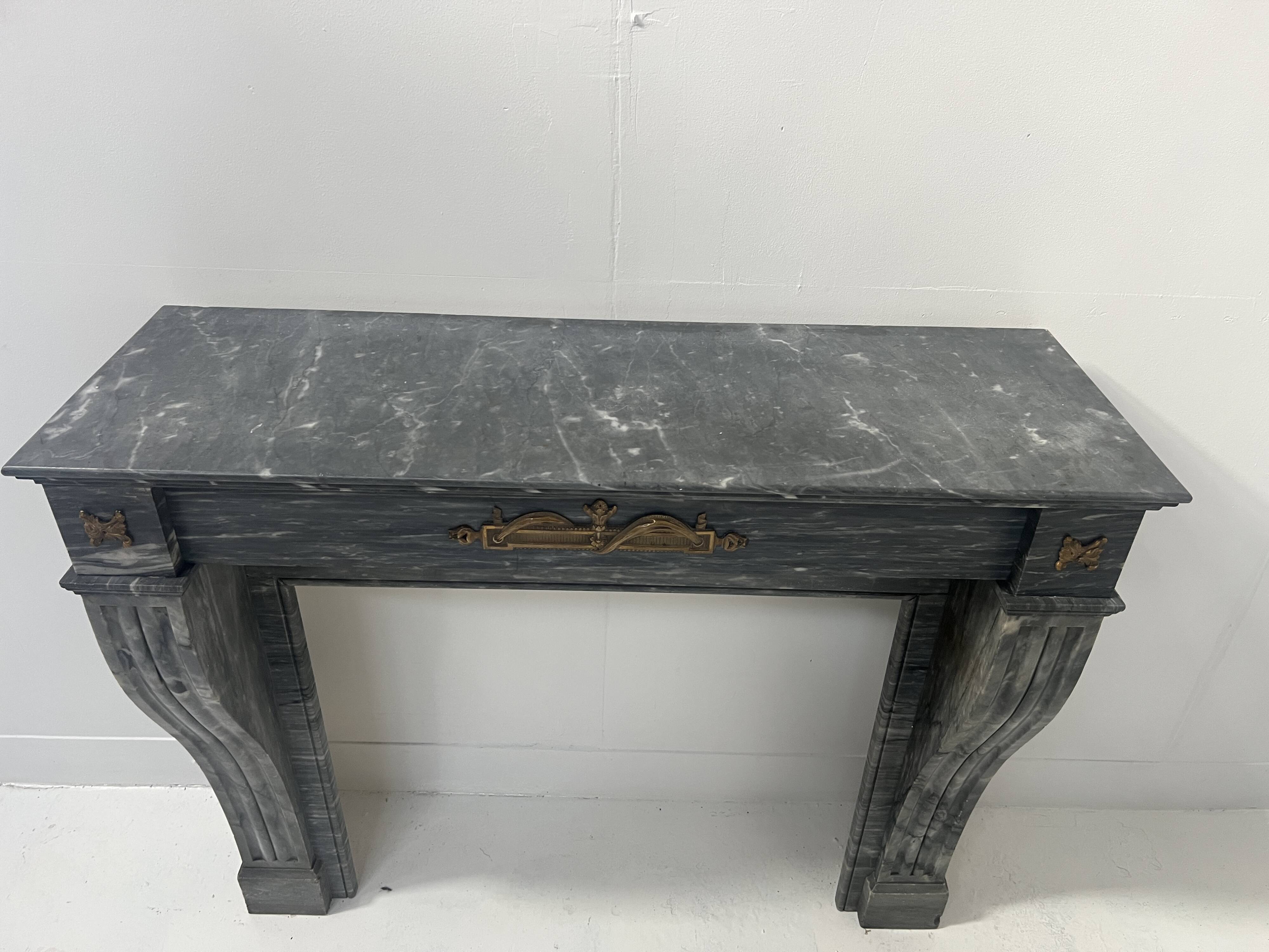 Napoleon III fireplace in blue Turquin marble from the 19th century.